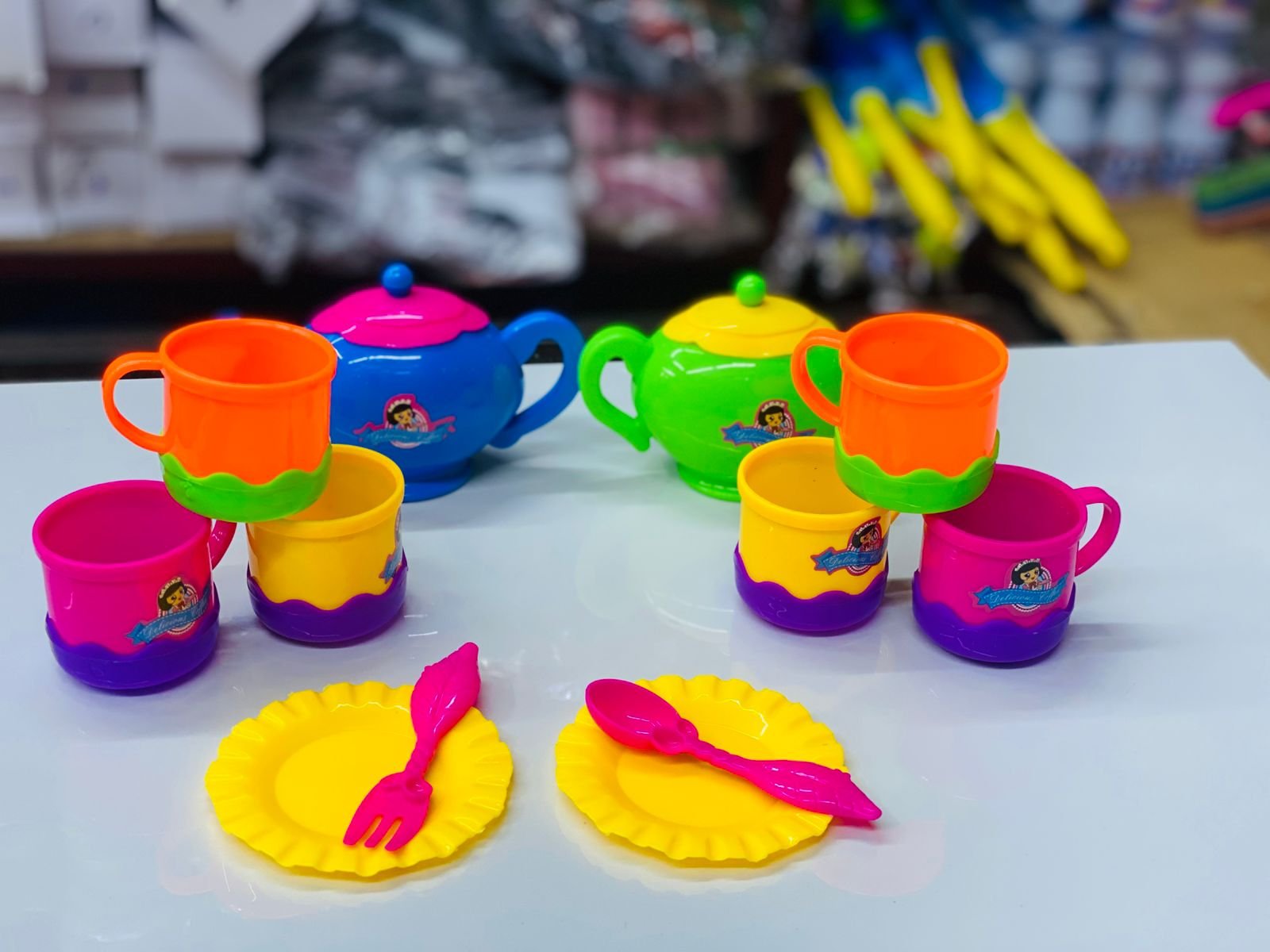 Colorful plastic toy tea set or children's kitchen pretend play set