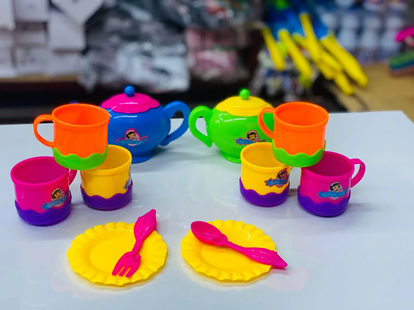 Colorful plastic toy tea set or children's kitchen pretend play set